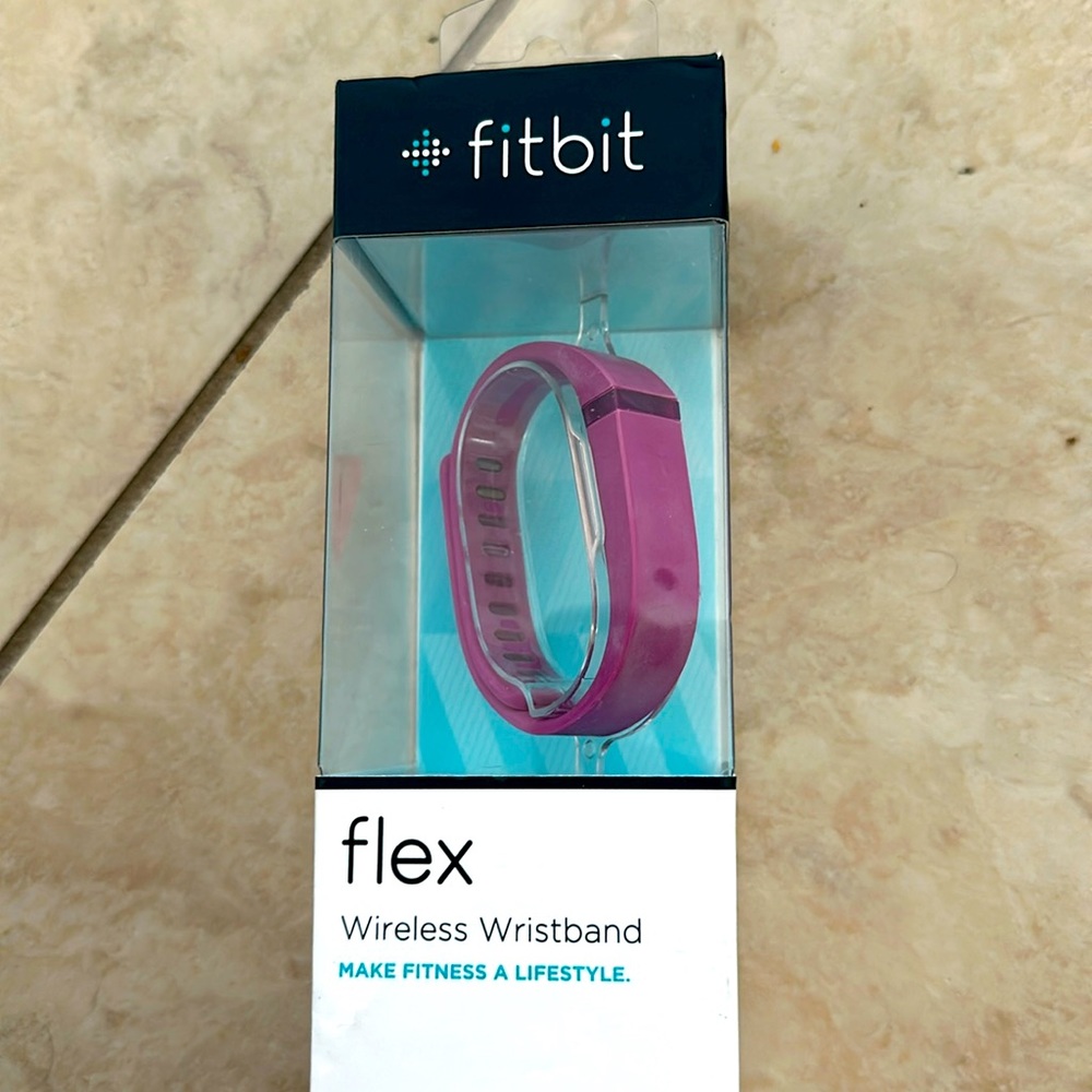 Fitbit Flex: pink wireless wristband- sealed in box. Has some discoloration